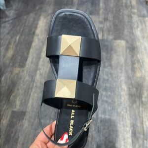 Black Sandals with Gold Accents
